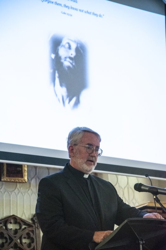 The Rev. Richard E. Evans Jr., Groome Church associate pastor, reads a passage.